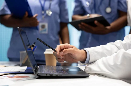 Healthcare professionals working in a medical facility protected by professional healthcare security service